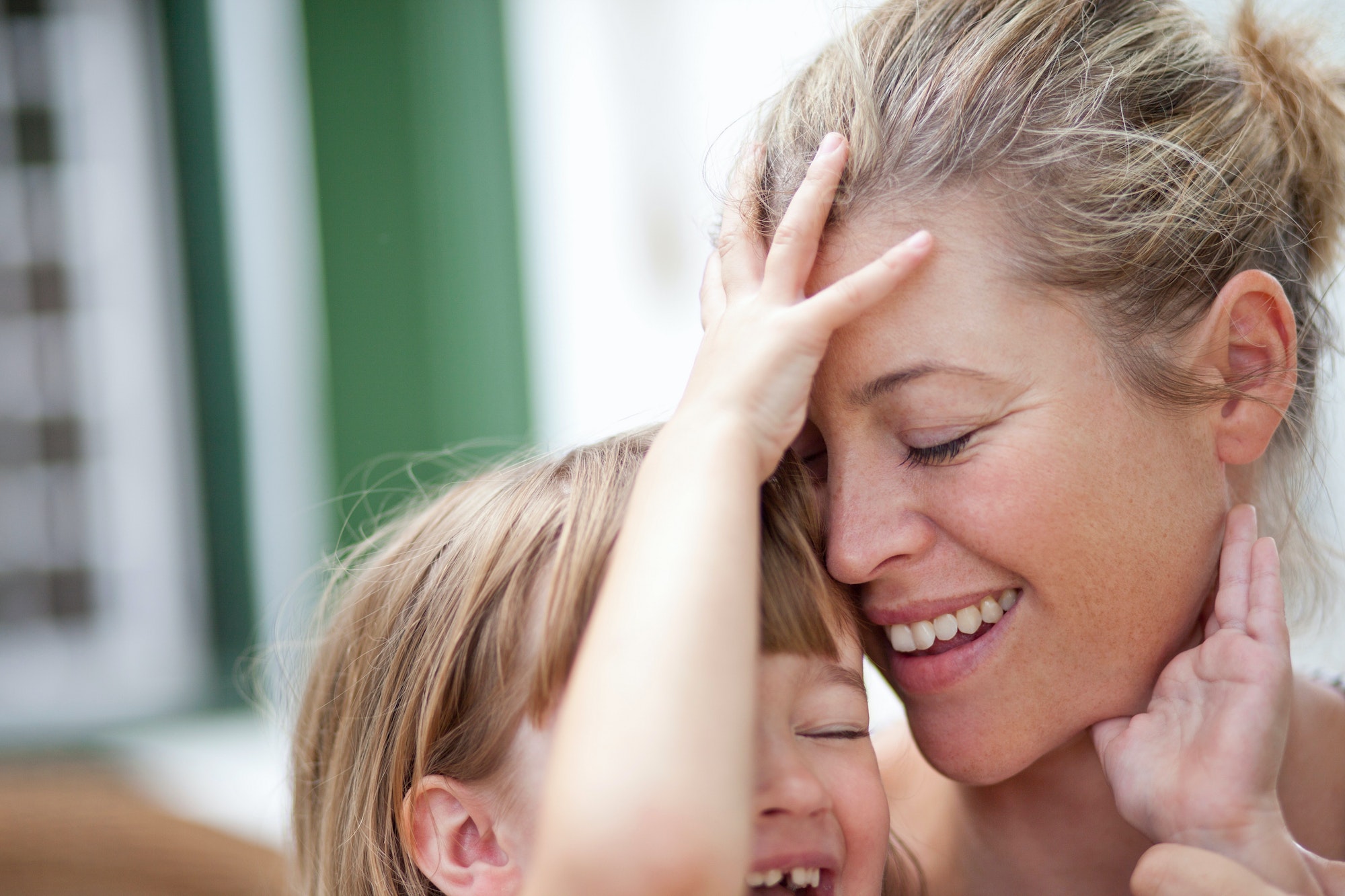 Mom hugging kid